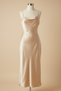 Champagne satin slip dress on a mannequin